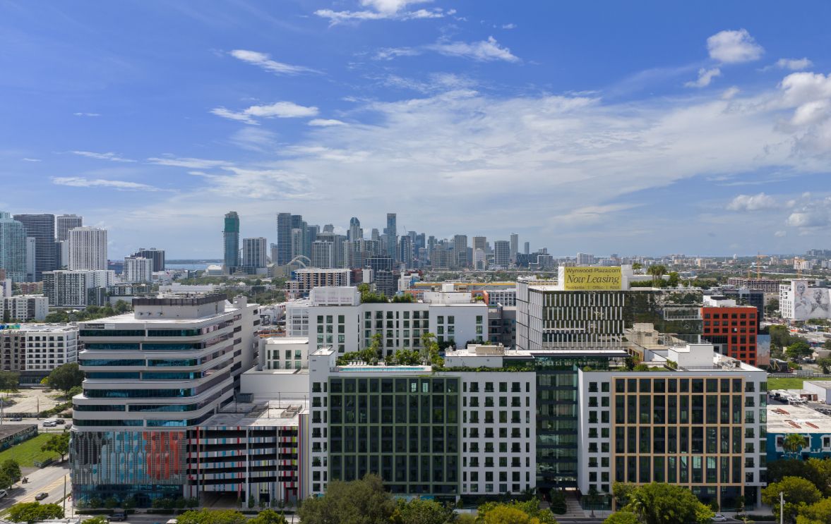 City skyline with modern buildings and blue sky.