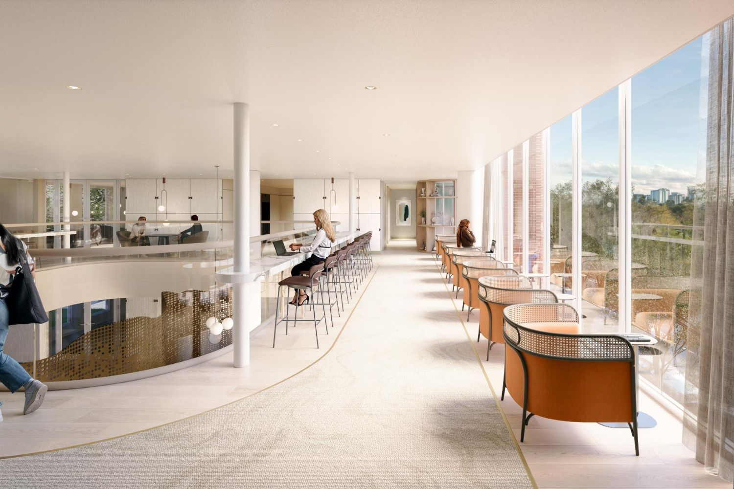 Modern interior with seating, large windows, and natural light in a spacious setting.