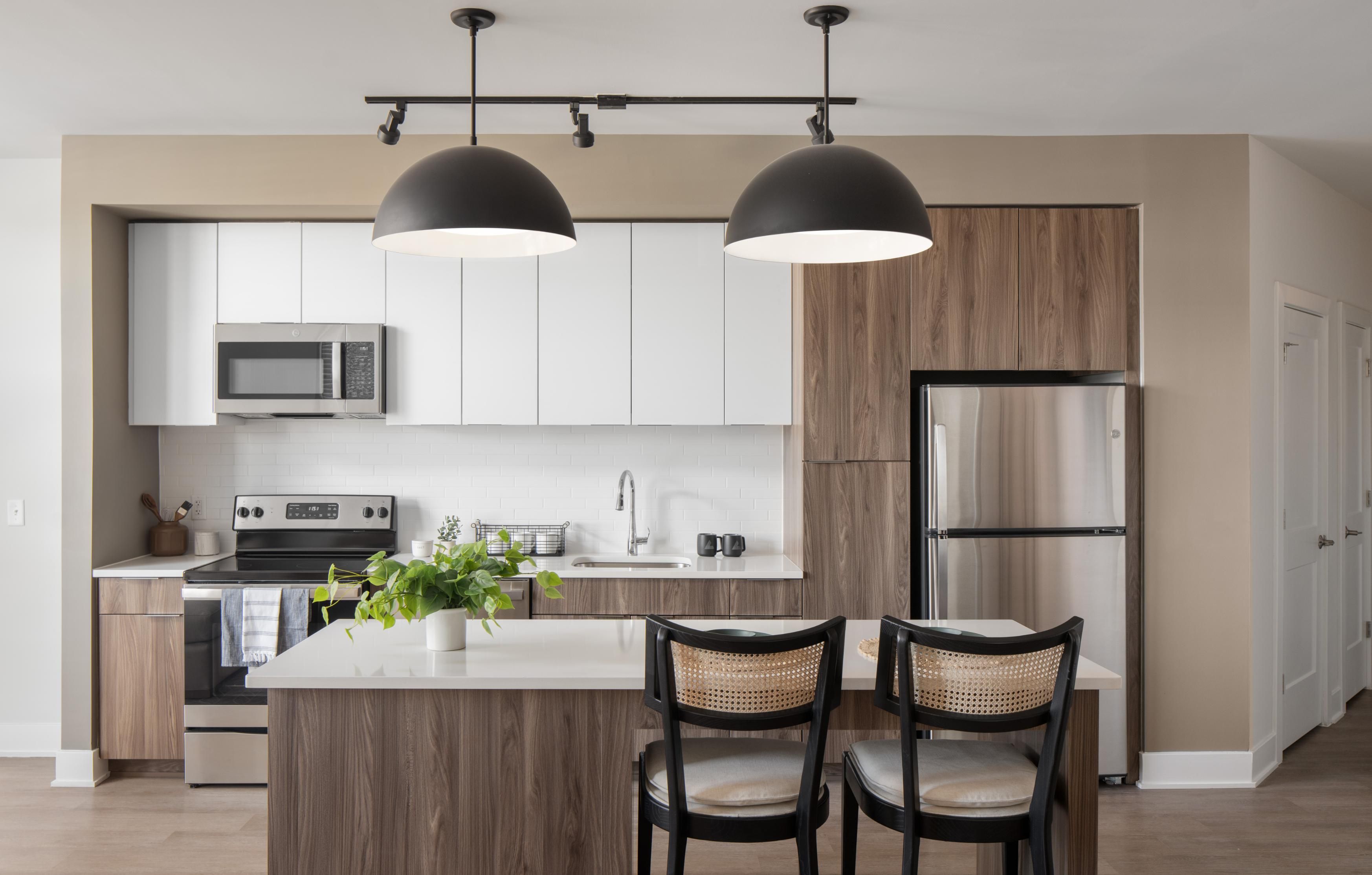 Apartment kitchen with island dining setting