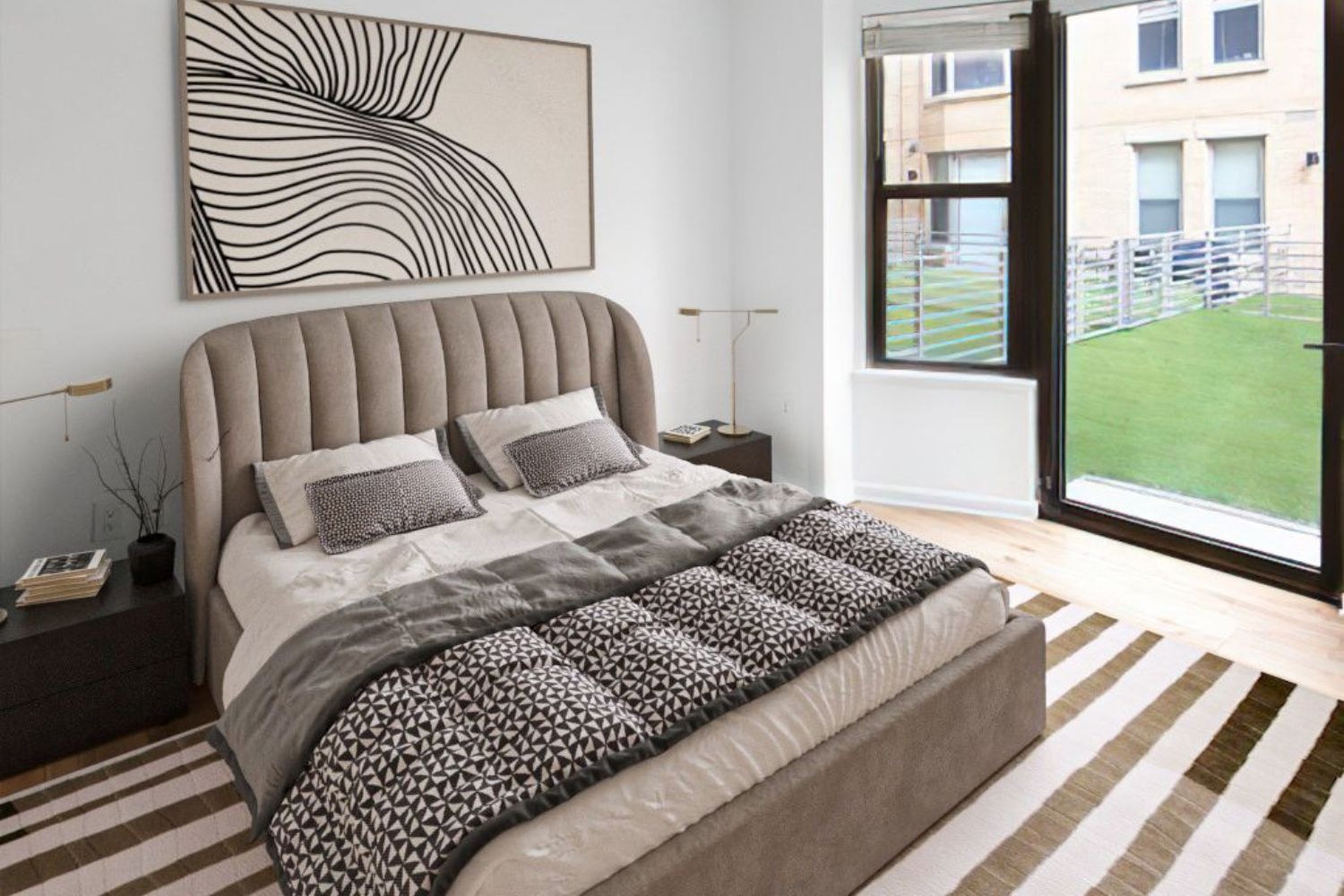 Cozy bedroom with a plush bed, modern art, and large windows overlooking green space.