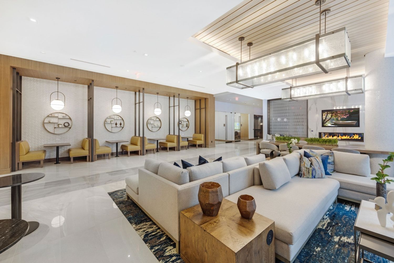 Modern hotel lobby with stylish seating, decorative accents, and ambient lighting.