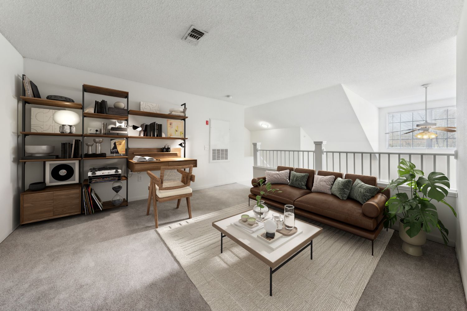 A modern living room with a brown sofa, bookshelf, and small coffee table.