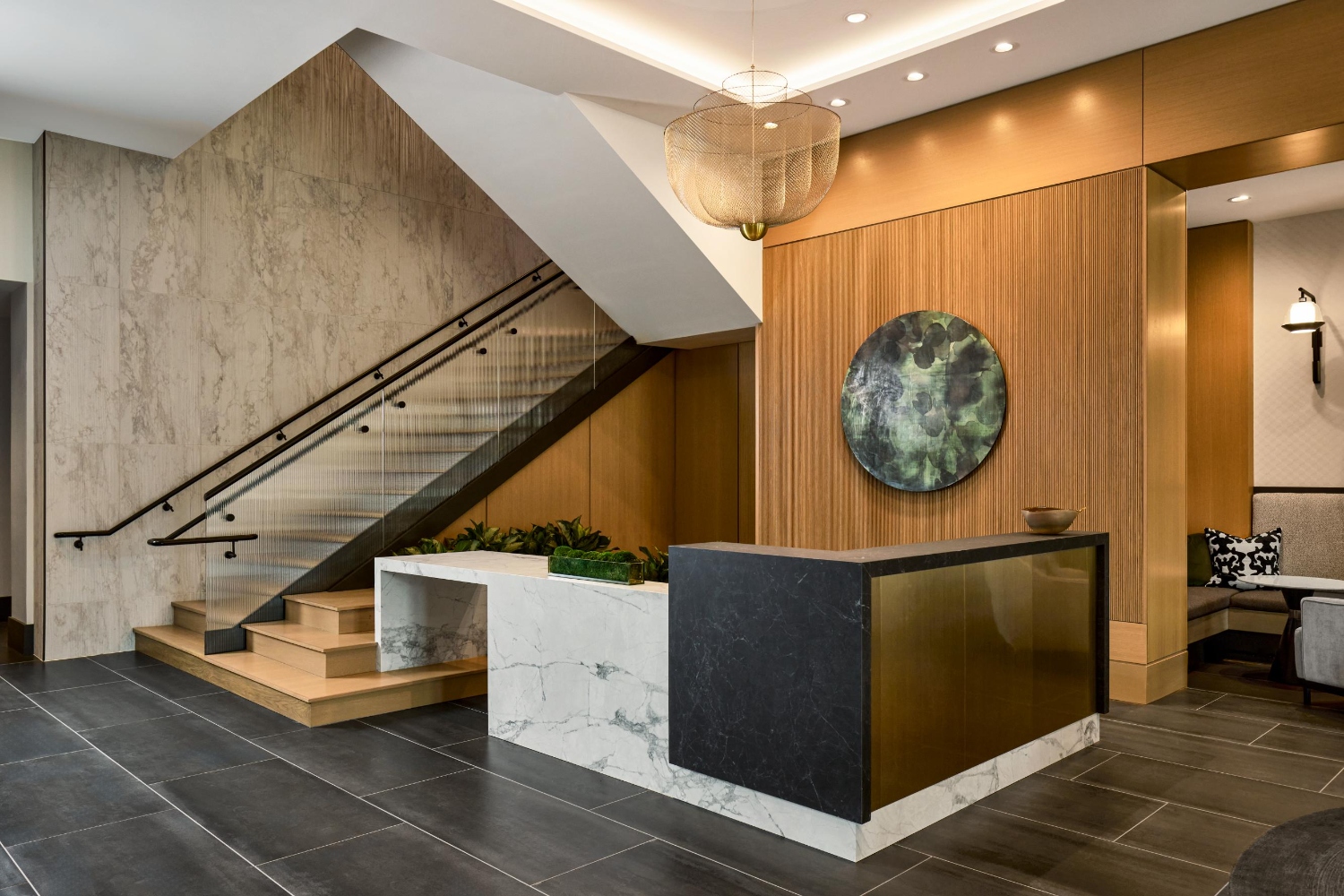 A refined arrival experience at Coulter Place with curated finishes and inviting seating