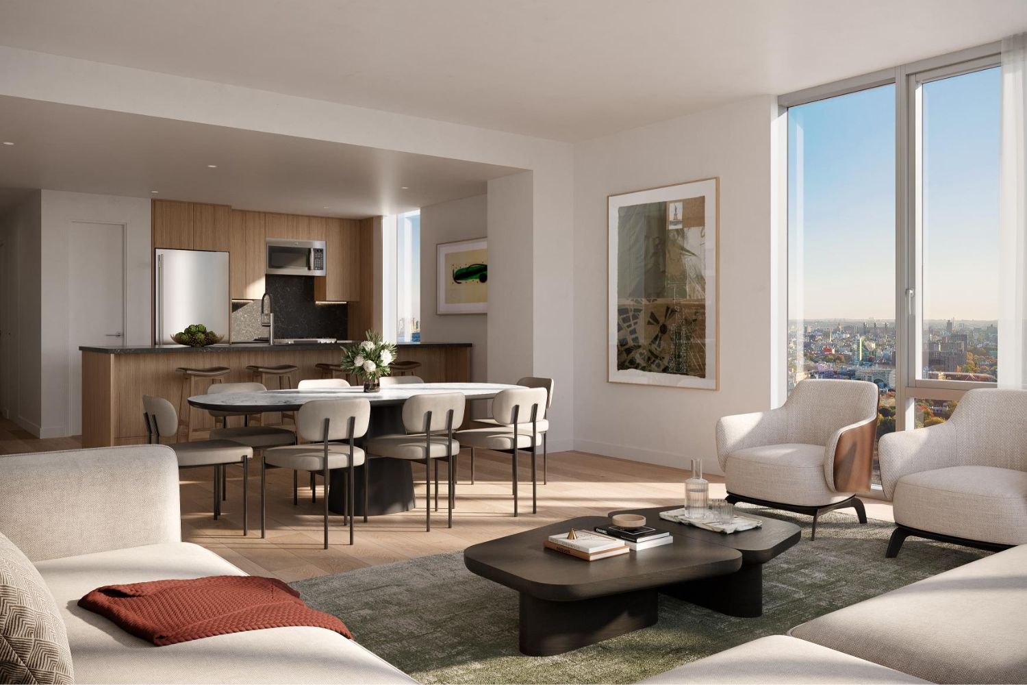 Modern open-concept living space with kitchen, dining area, and large windows.