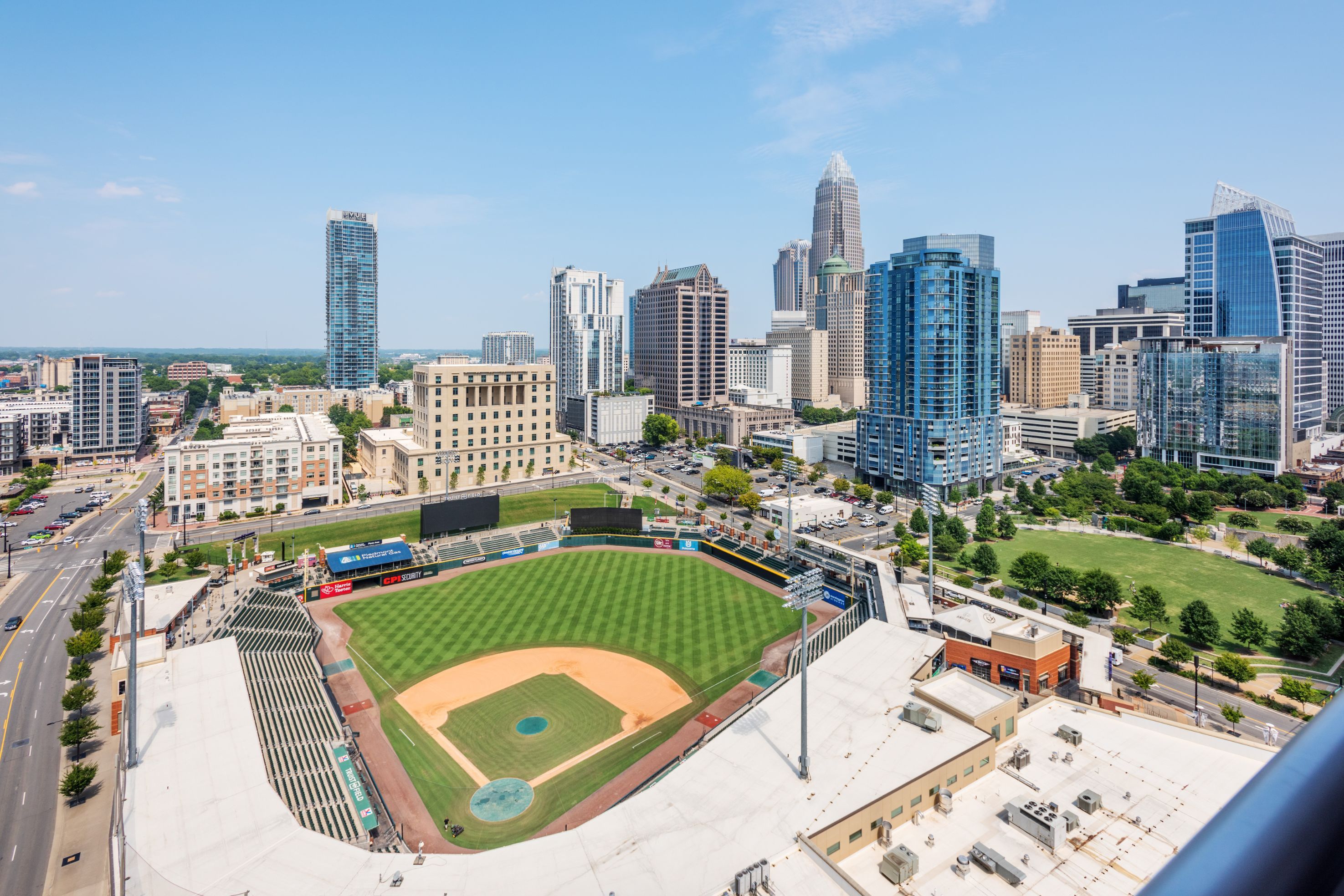 Aerial view of a baseball field surrounded by a city skyline.
