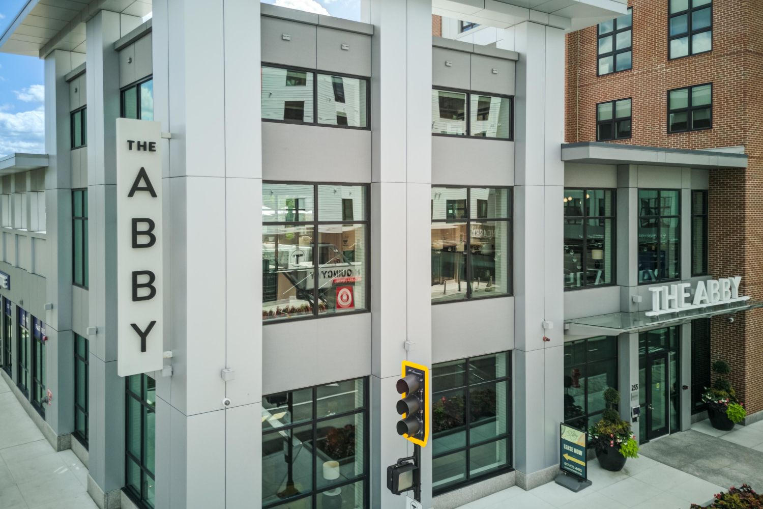 The Abby landmark sign with a captivating corner view of the neighborhood.