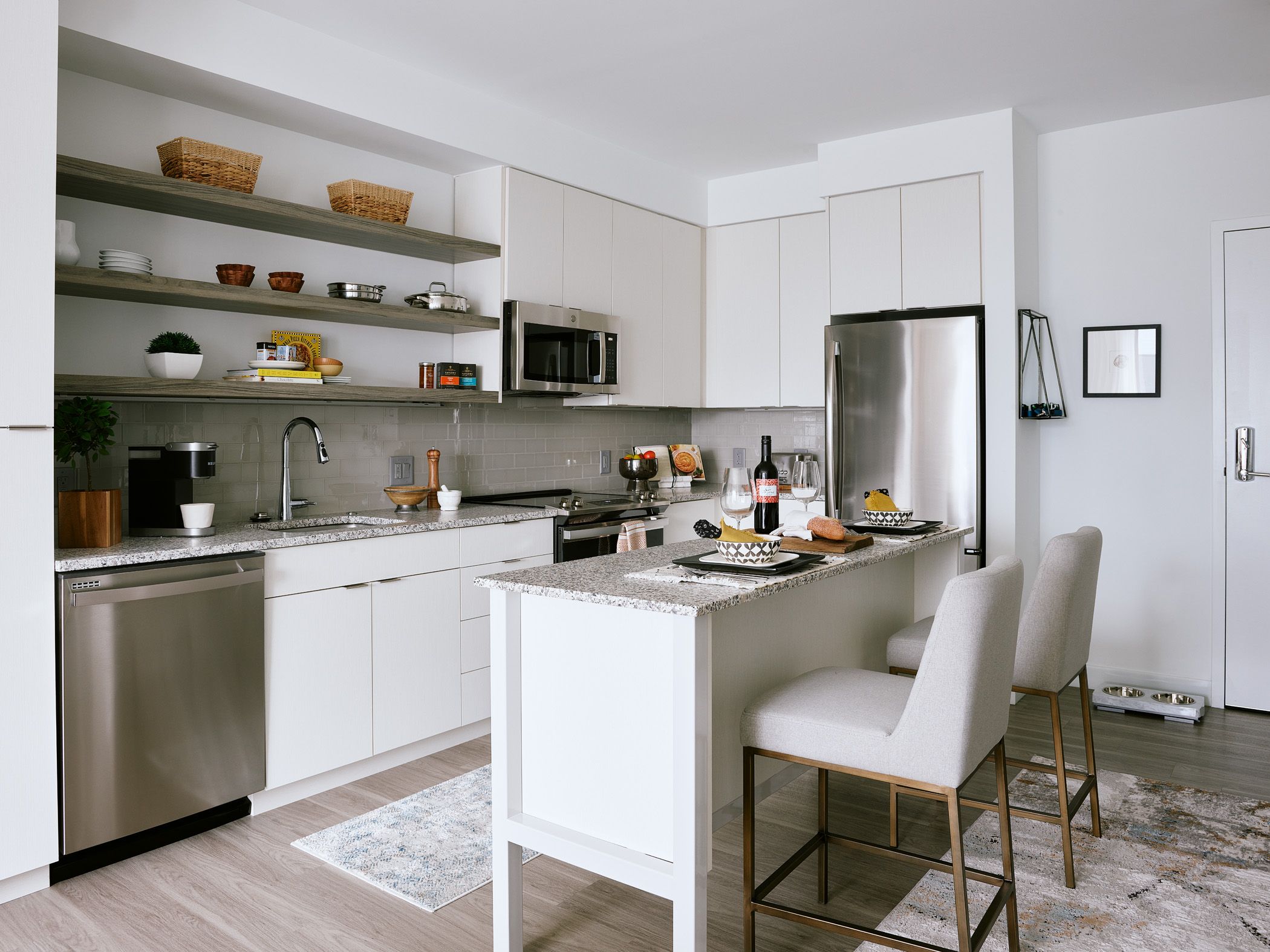 The Abby's kitchens feature brand new stainless steel appliances from Moen.