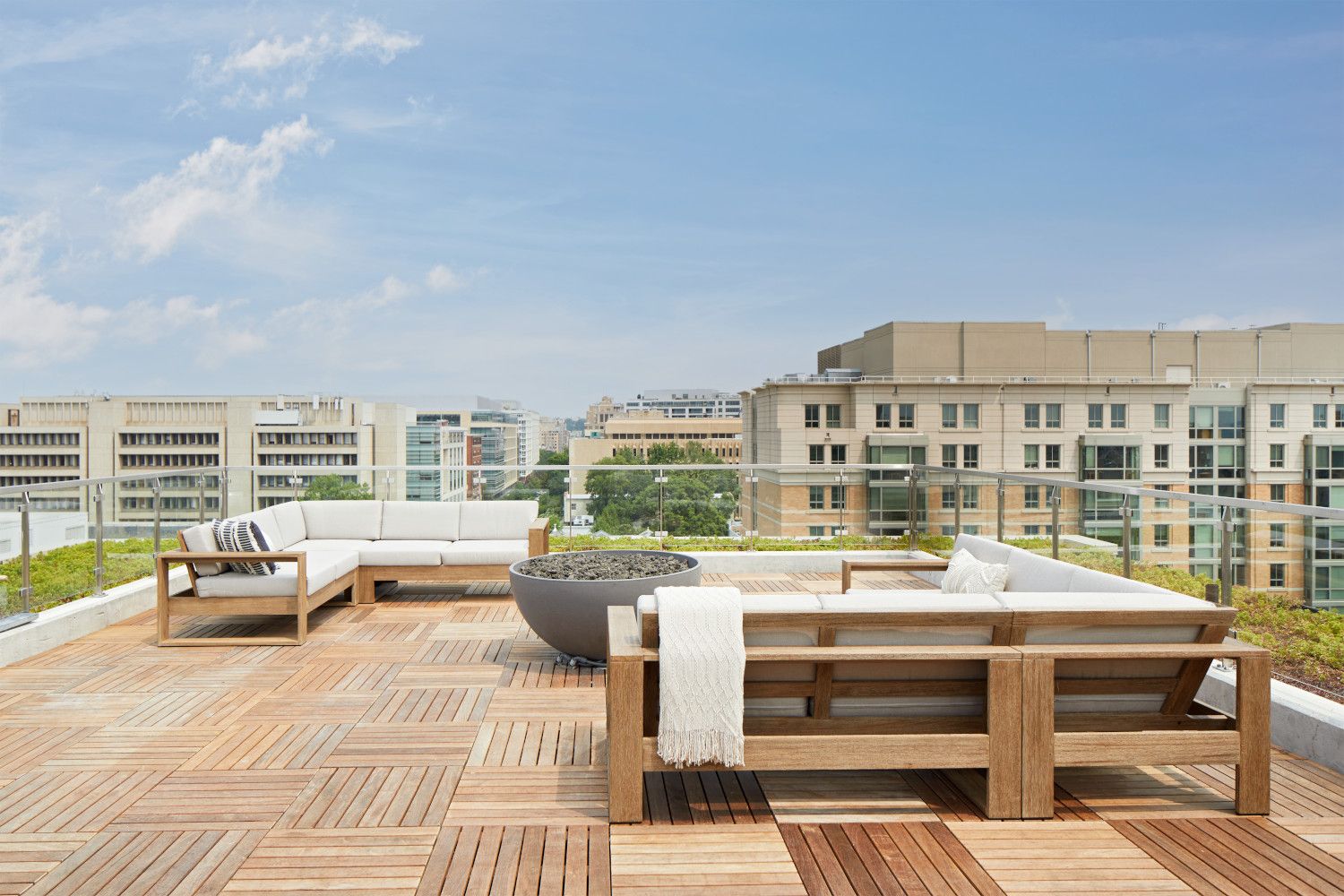 Indulge in outdoor comforts from the rooftop terrace with grills, dining tables, seating, fire pit, and garden enclosure.
