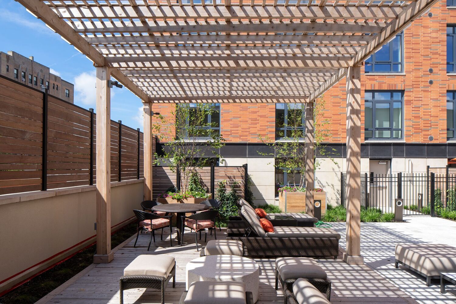 Resort-style pool deck with private pergolas