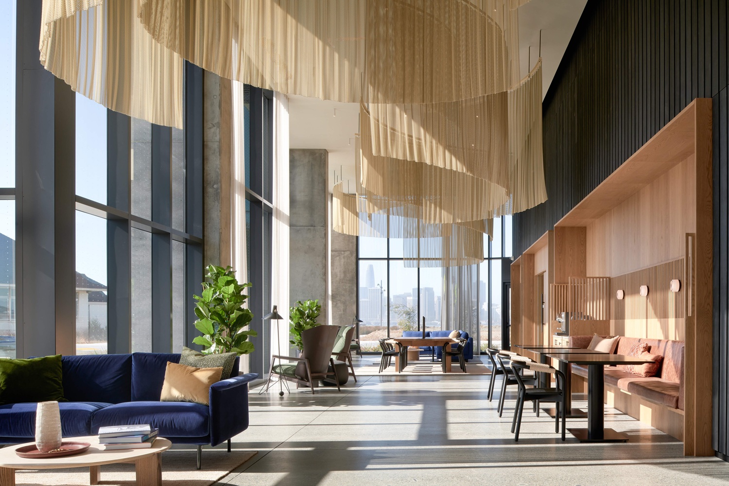 Spacious lobby lounge at Isle House featuring modern seating, soaring ceilings, and designer finishes on Treasure Island in San Francisco.
