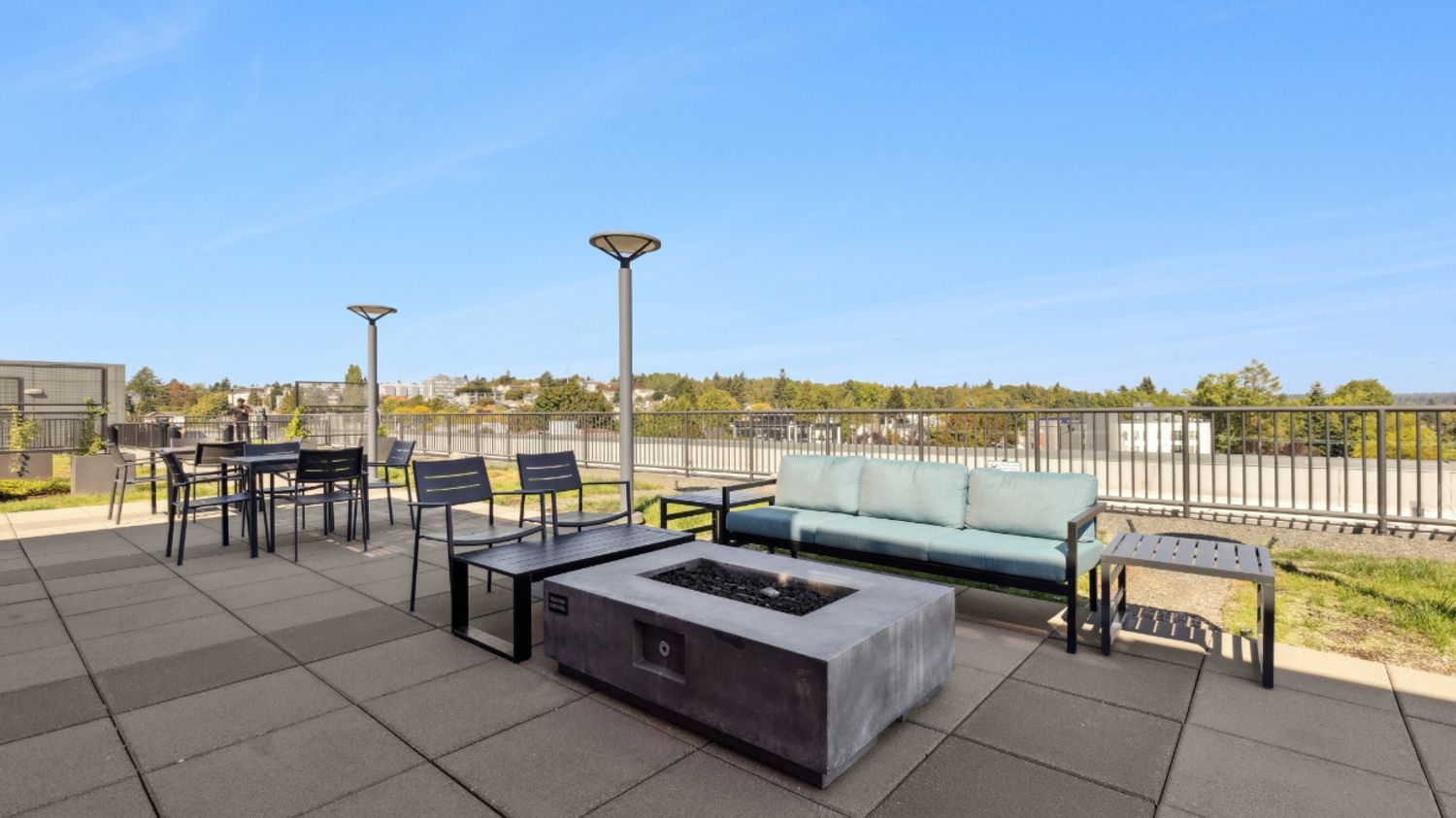 Smith & Burns apartment rooftop firepit seating area in Wallingford, Seattle