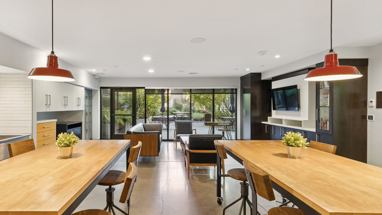 Amenity lounge at Smith & Burns Seattle apartments with modern seating