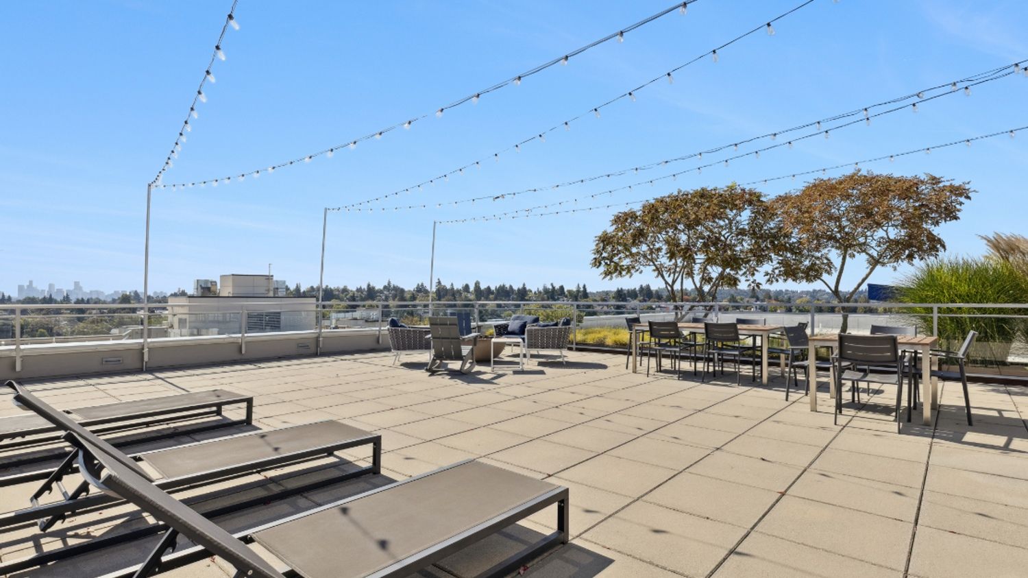 Eleanor Seattle rooftop lounge with city skyline view