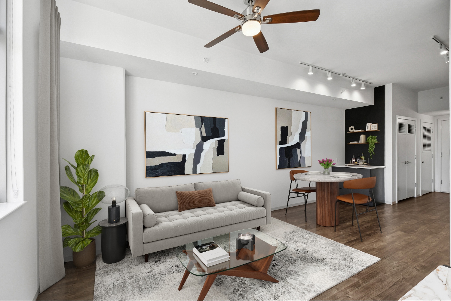 Livingroom with couch and chairs and kitchen in background