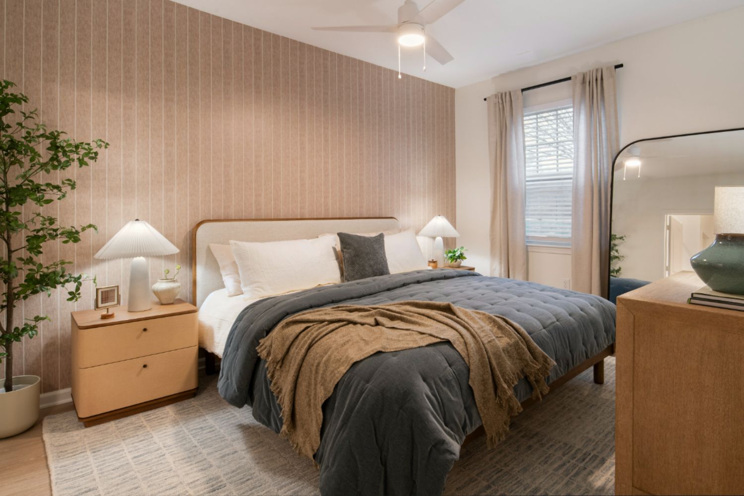 Bedroom with blanket over corner