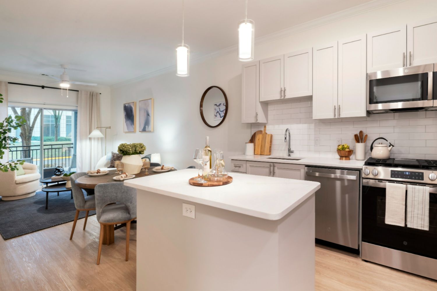 Kitchen with white stone counters and cabinets