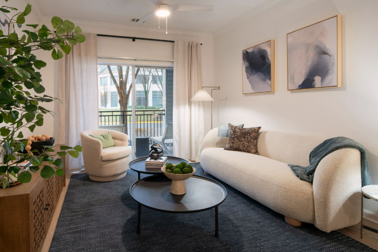 Blue rug with tan couch and console