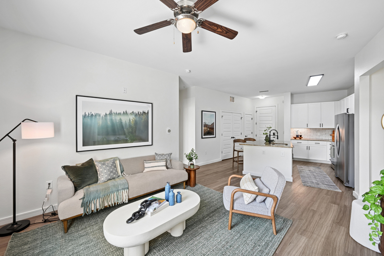 An Aera RiNo apartment in Denver has an open living room next to the kitchen.