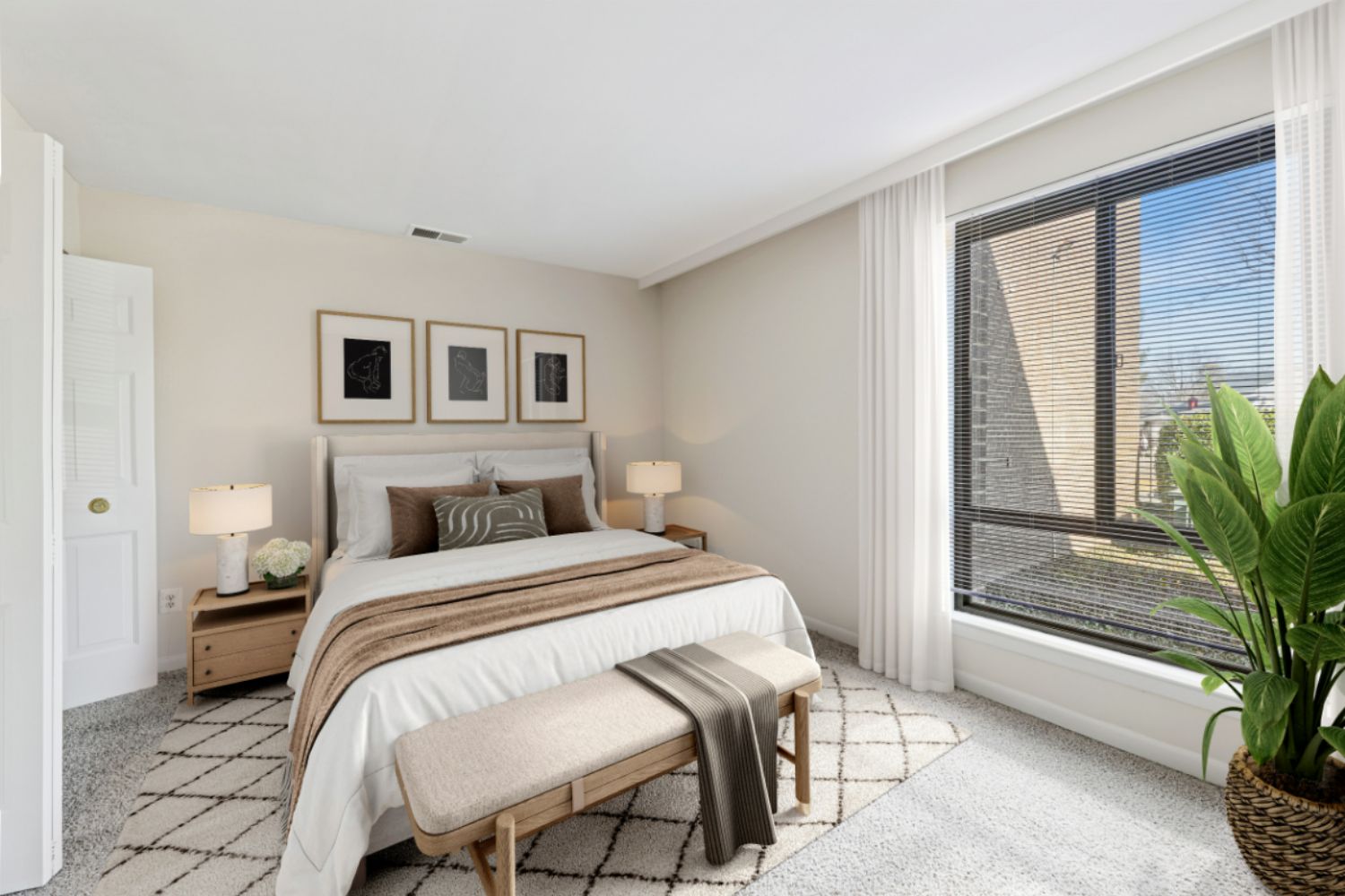 Bedroom with bed with tan blankets