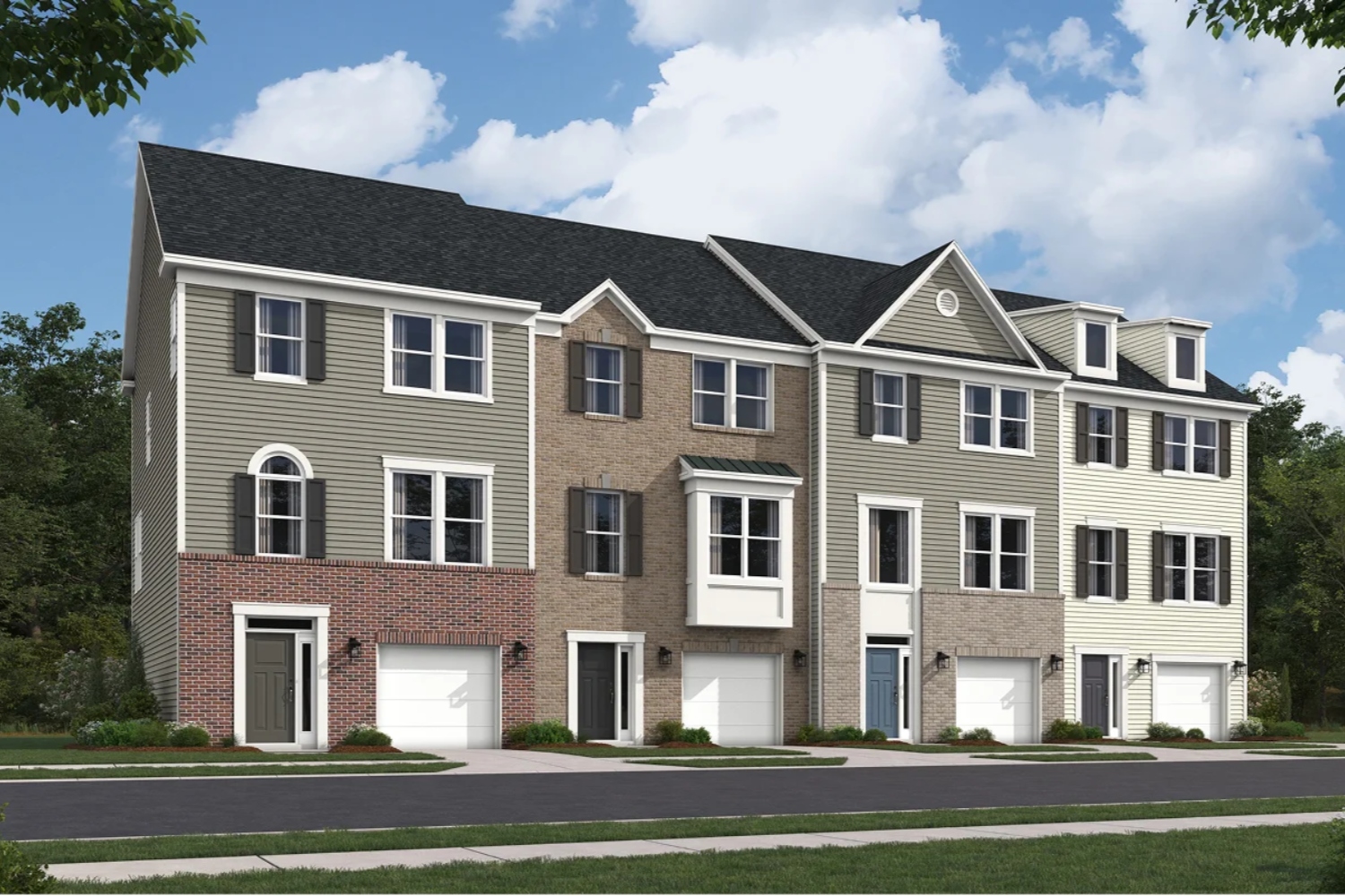 Three-story townhouses with a mix of brick and siding under a partly cloudy sky.