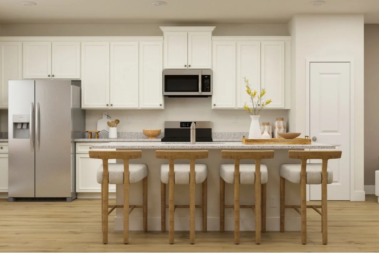 Modern kitchen with white cabinets, stainless steel appliances, and a central island with stools.