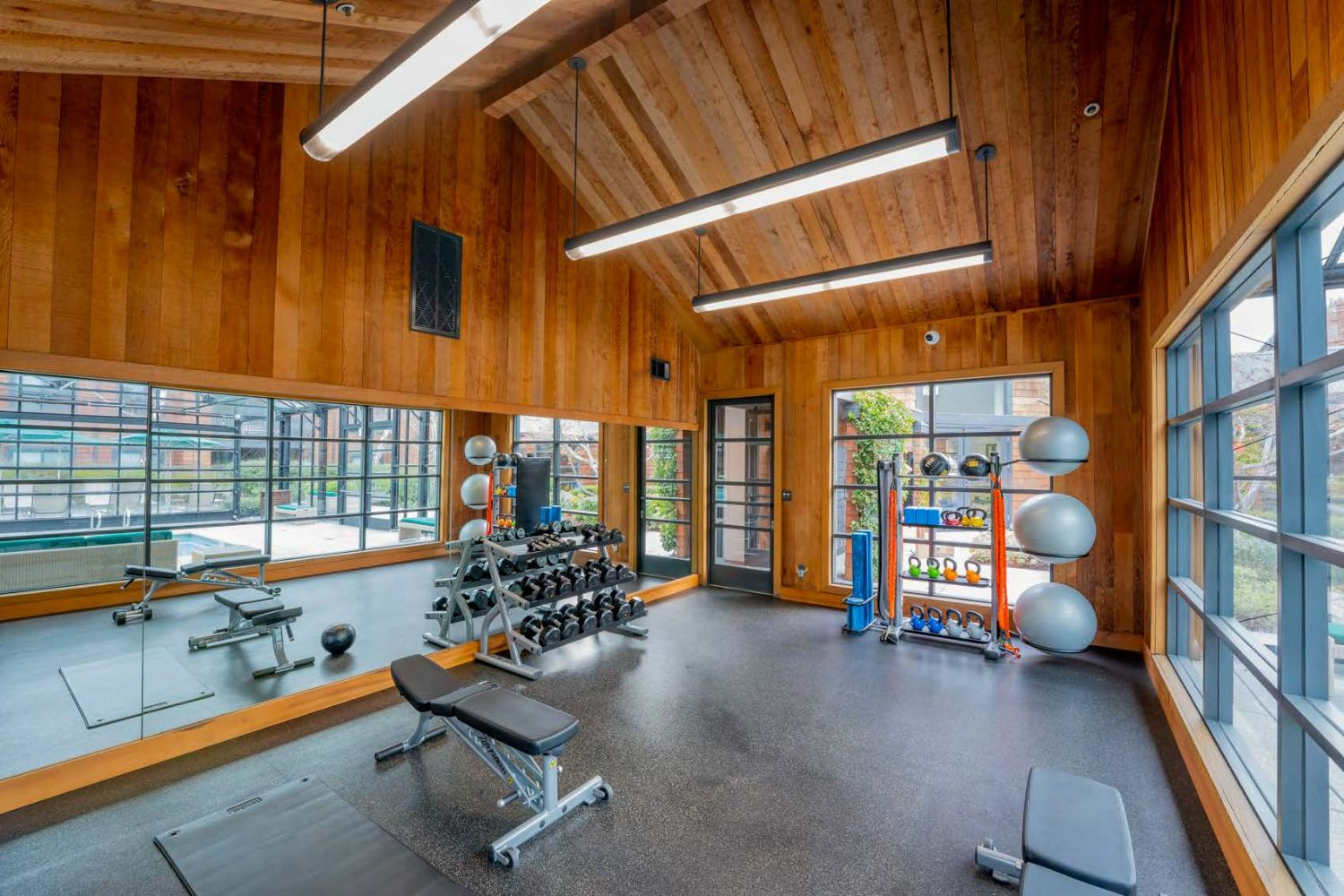 Fully equipped gym with cardio machines and open layout
