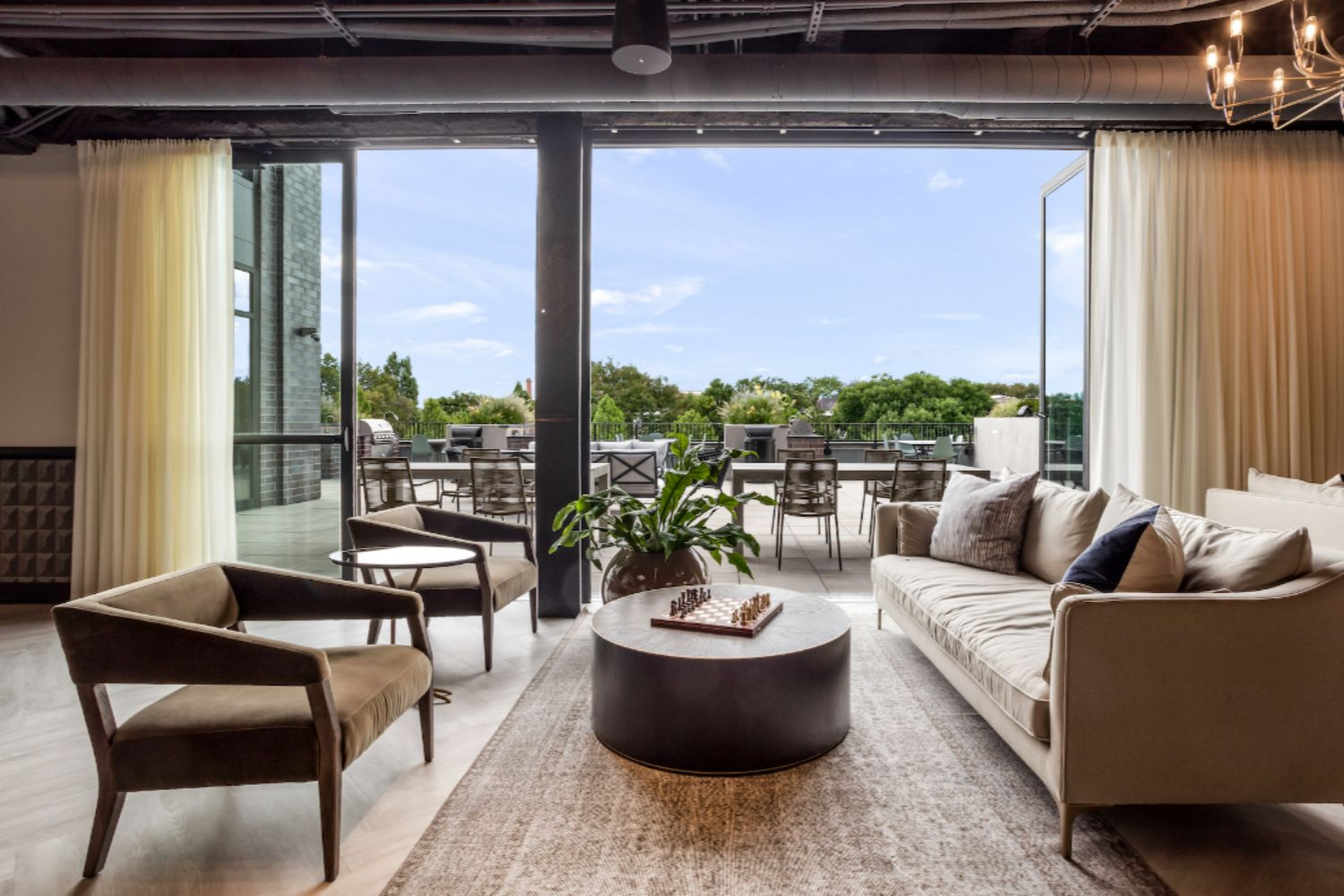 Resident clubroom at Logan Apartments in Logan Square Chicago with upscale lounge seating and modern design
