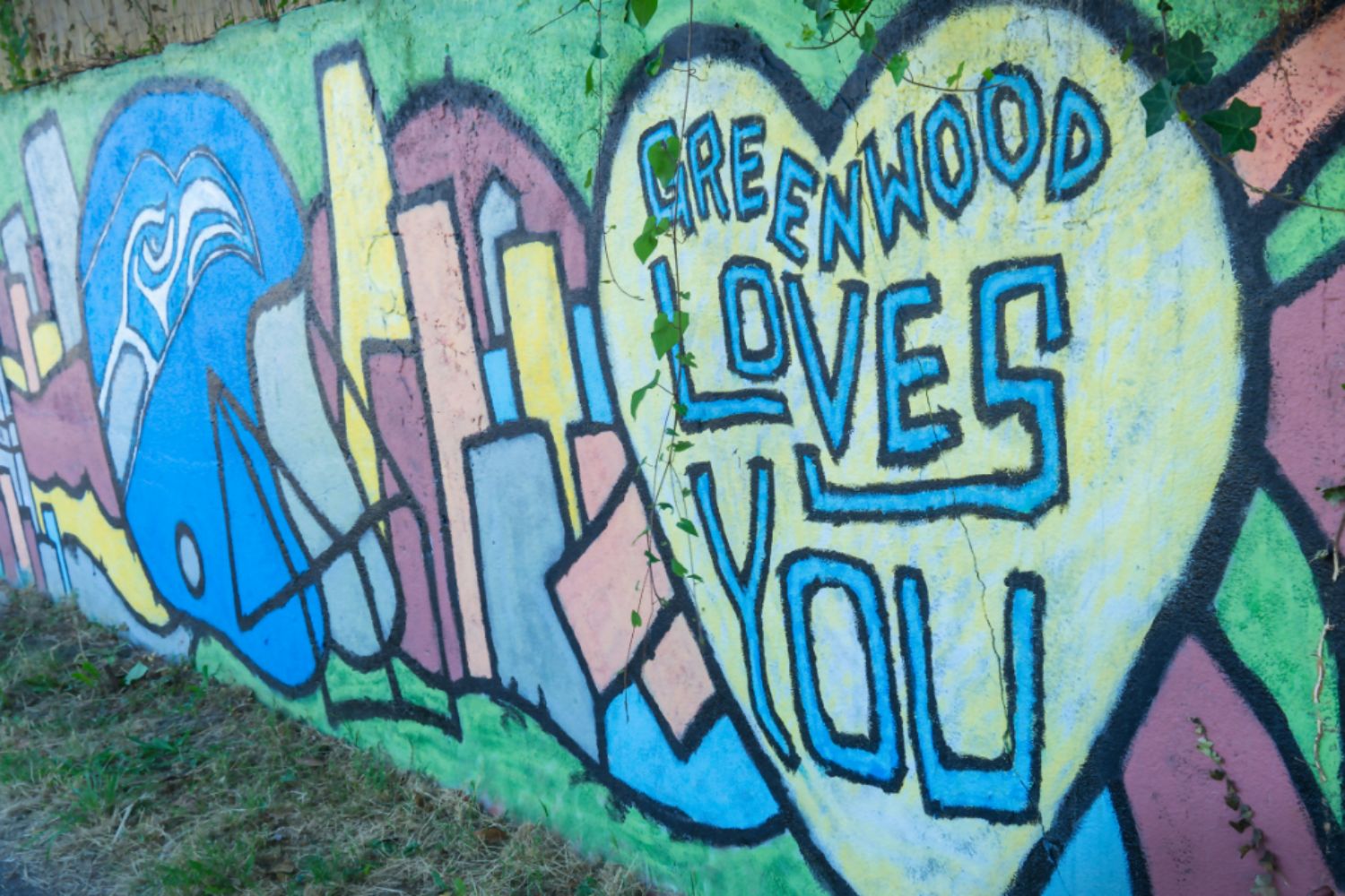 Urban street art in Greenwood Seattle showcasing vibrant murals near Janus Apartments