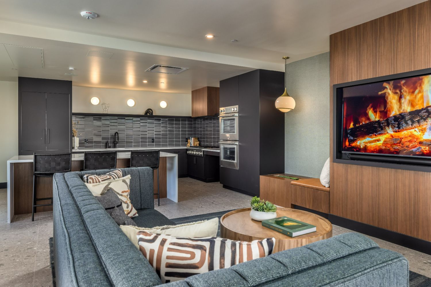Shared apartment kitchen with modern appliances and dining area