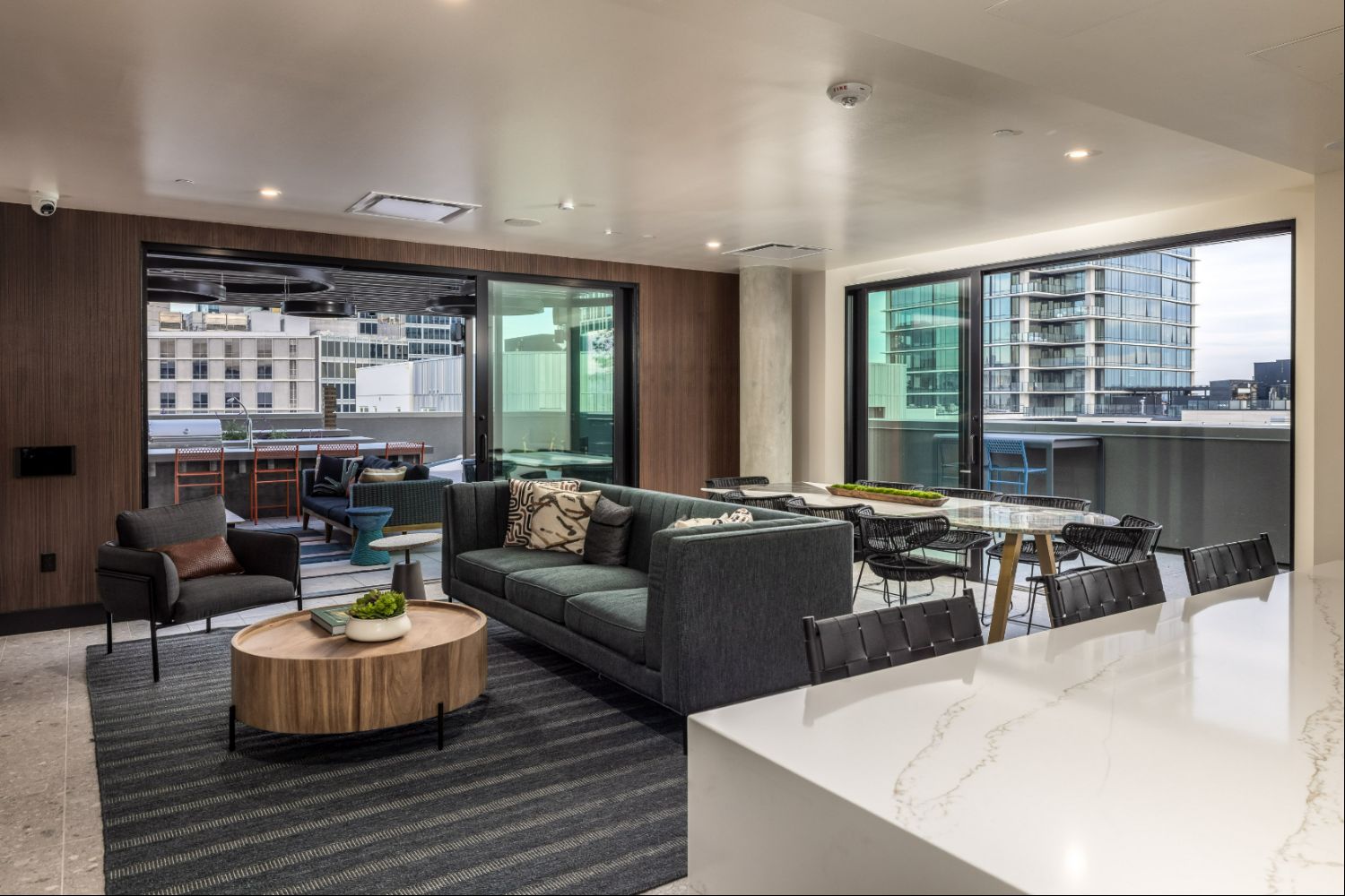 Luxury rooftop terrace with lounge seating and San Francisco skyline views