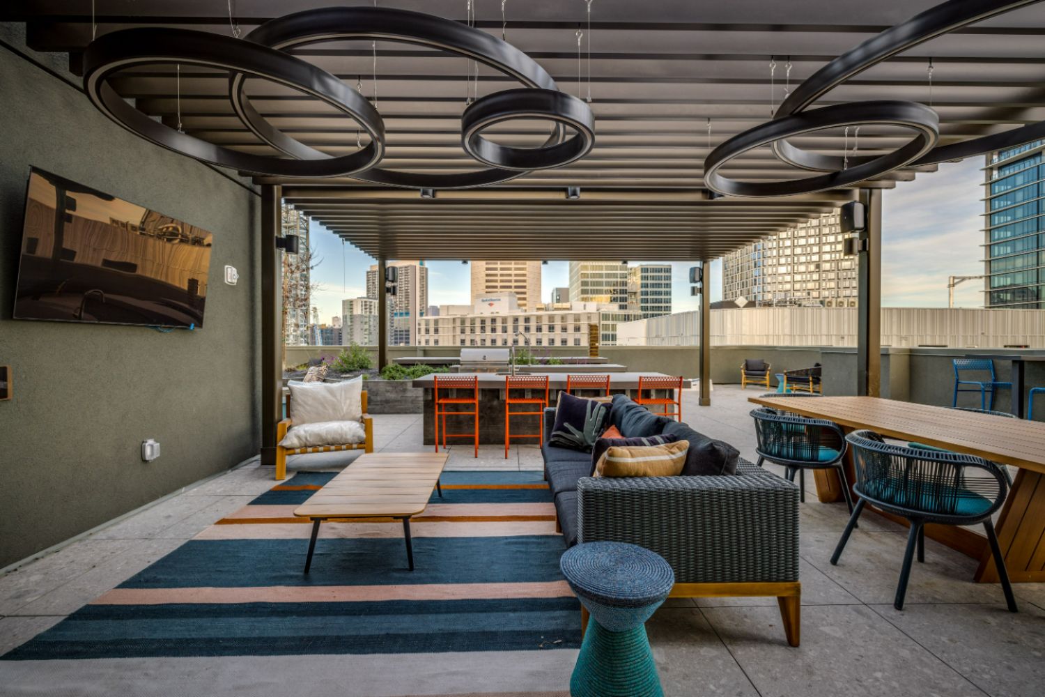 Luxury rooftop terrace with lounge seating and San Francisco skyline views
