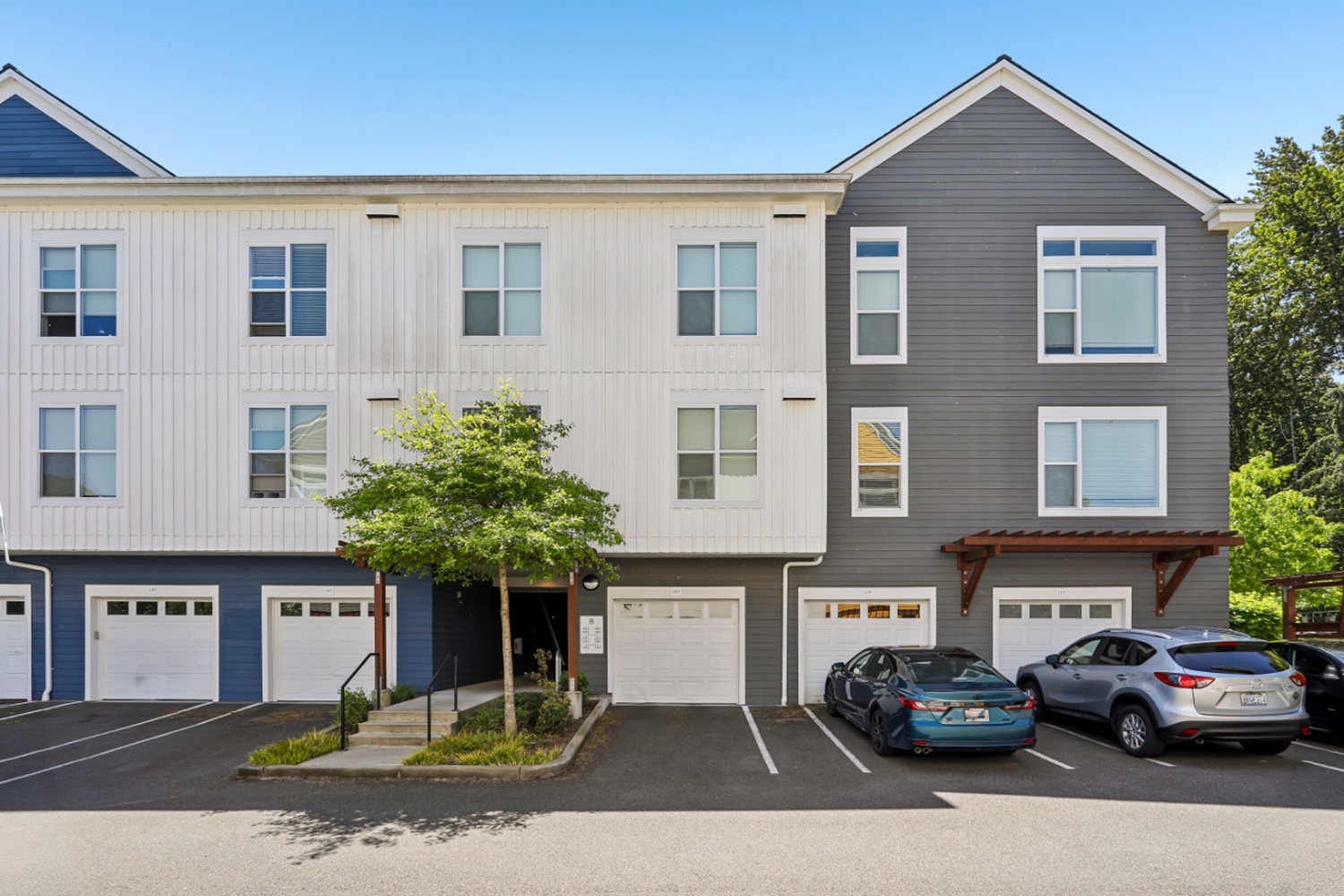 Exterior view of Anthology Apartments showcasing garage and parking spaces.