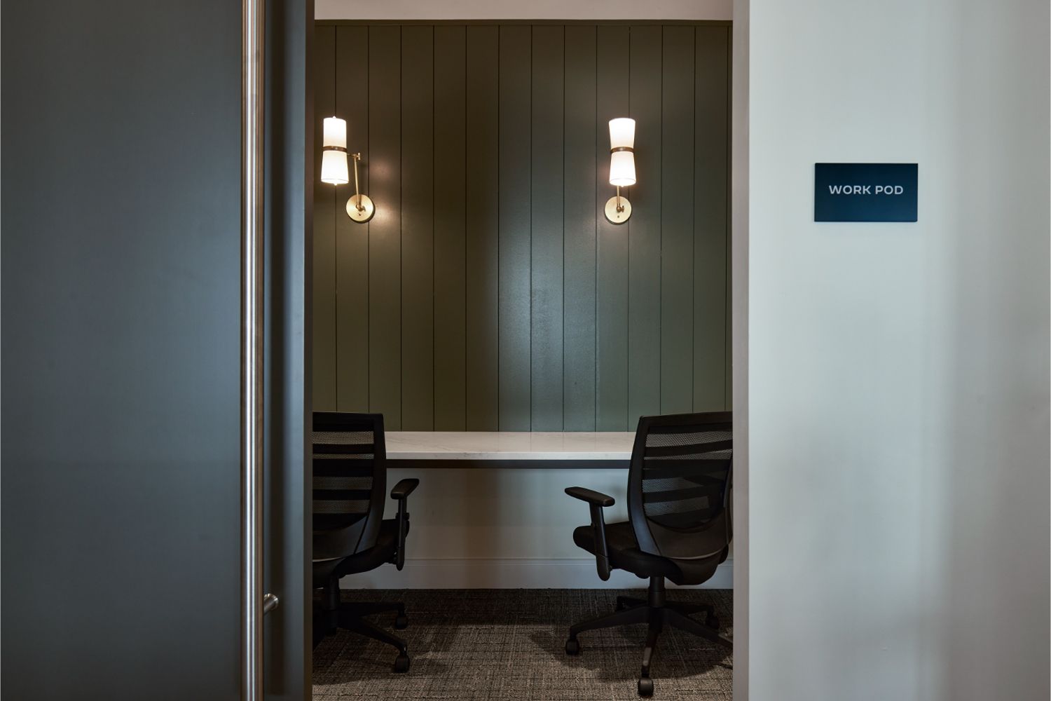Private work pod with desk and chairs at Alexan Brandywine luxury apartments in Brandywine, MD.