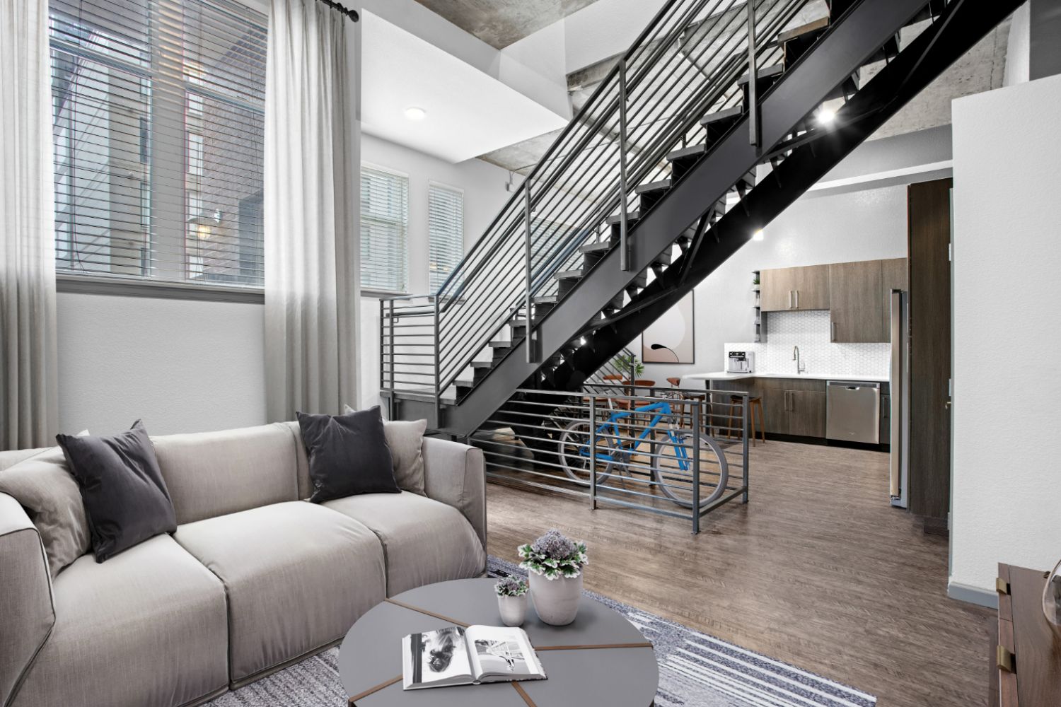 Elegant living room with contemporary furniture and a staircase behind it