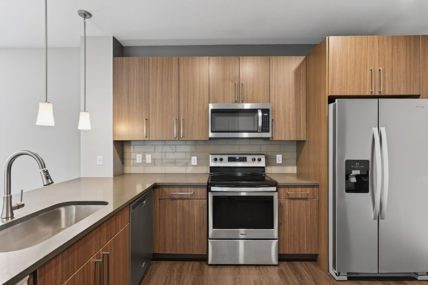 Luxury kitchen with wood cabinets and stainless steel appliances