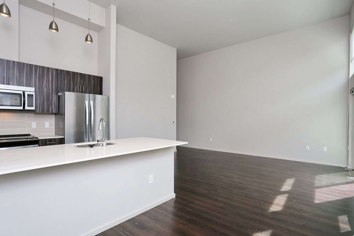 Spacious open-plan kitchen and living area with modern appliances.