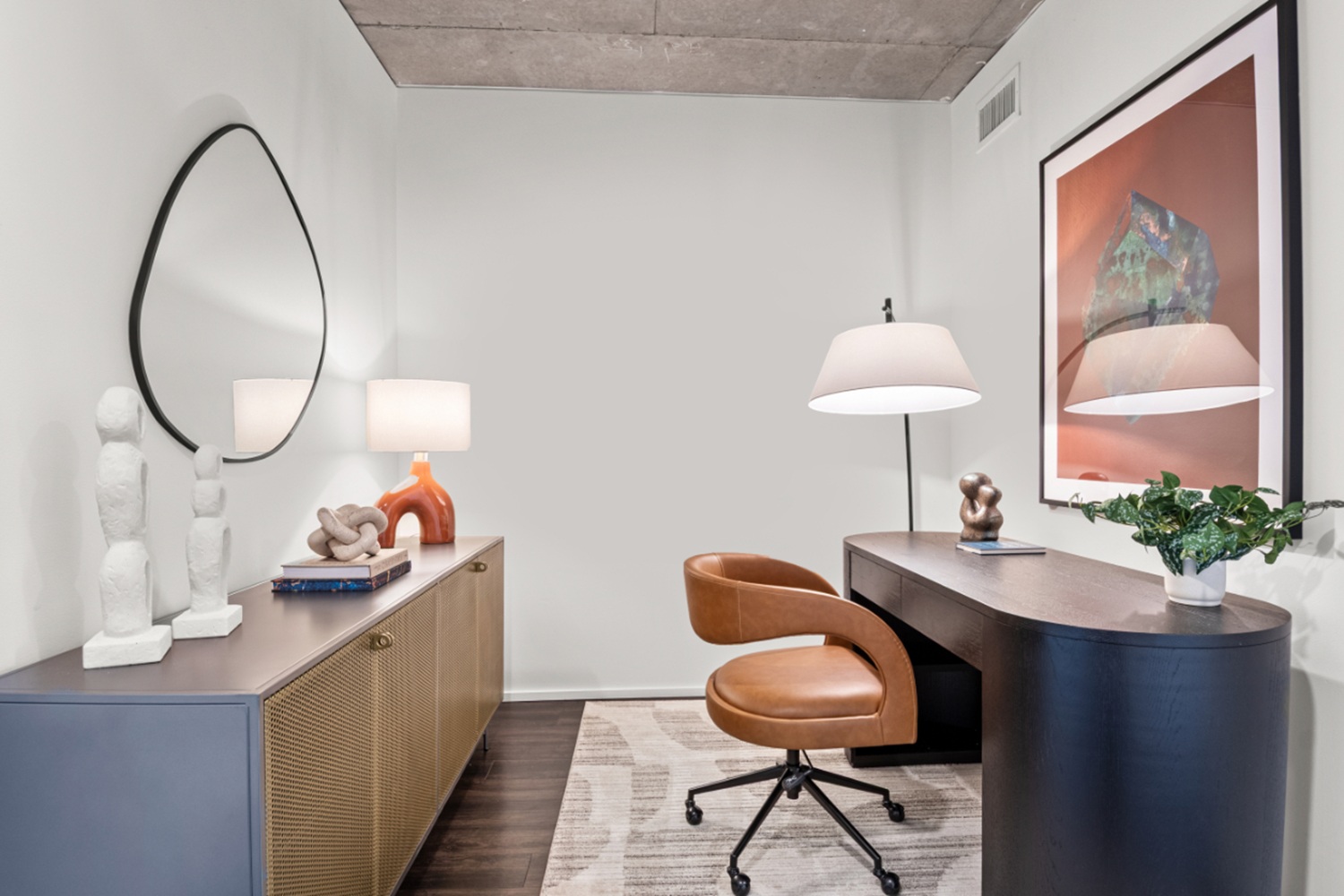 Home office space inside an NV Apartments residence with modern furnishings and clean contemporary design.