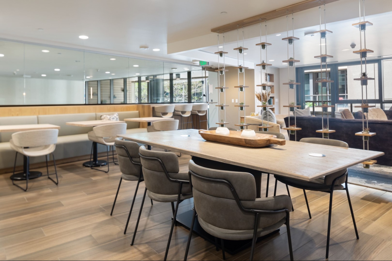 Modern dining area with wooden table and stylish chairs.