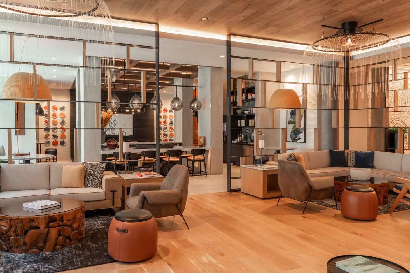 Modern living room with cozy seating, wooden accents, and decorative lighting.